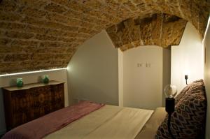 מיטה או מיטות בחדר ב-Sicily in Villas - Al Garaf in centro