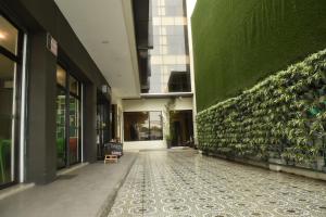 a hallway of a building with a green wall at Columbus Plaza Hotel in General Santos