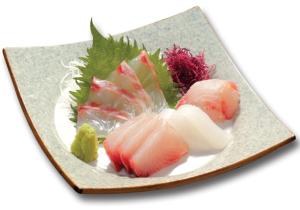 a plate of food with sushi on it at Hotel Rumieru Hyuga in Hyuga