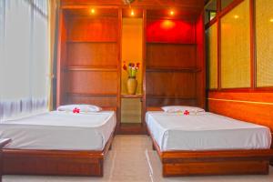 Postel nebo postele na pokoji v ubytování Melasti Beach Resort & Spa Legian