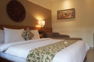Postel nebo postele na pokoji v ubytování Yulia Village Inn Ubud