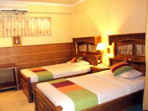 Postel nebo postele na pokoji v ubytování Melasti Beach Resort & Spa Legian