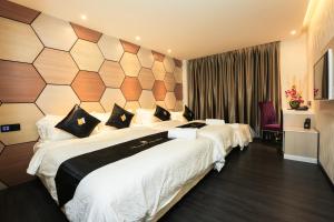 Postel nebo postele na pokoji v ubytování Mercury Boutique Hotel