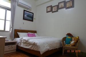 Postel nebo postele na pokoji v ubytování Fu Courtyard Homestay