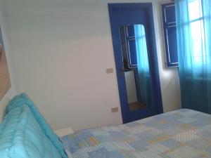 A bed or beds in a room at La Casa di Chico