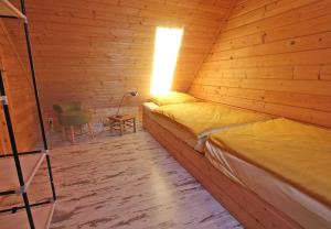 Ein Bett oder Betten in einem Zimmer der Unterkunft Ferienhaus Kleinzerlang SEE 9371