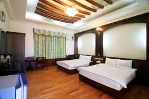Letto o letti in una camera di Yi Xin Homestay