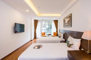 TV a/nebo společenská místnost v ubytování Thang Long Espana Hotel