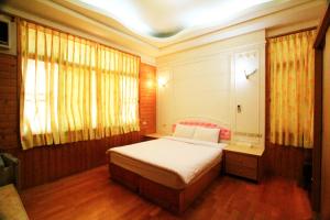 
A bed or beds in a room at Yi Xin Homestay
