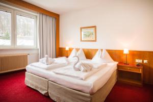 En eller flere senger på et rom på Am Neutor Hotel Salzburg Zentrum