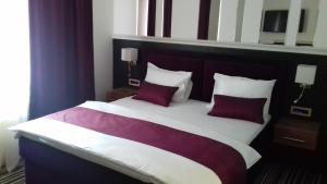 Voodi või voodid majutusasutuse Hotel Prezident toas