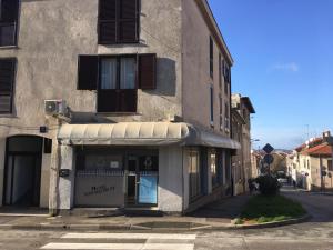 a store with an awning on the side of a building at Apartment Dada in Pula