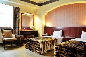 Postel nebo postele na pokoji v ubytování Family Hotel - Linsen