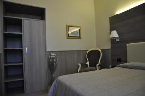 Postel nebo postele na pokoji v ubytování Hotel Est Piombino