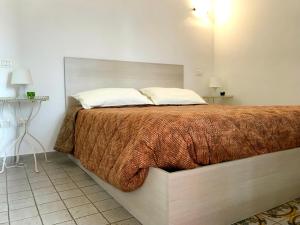 Postel nebo postele na pokoji v ubytování Belvedere Piano di Sorrento