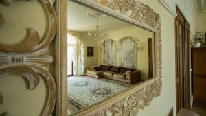 a mirror reflection of a living room with a couch at Private Villa First line with sea view in BlackSeaRama Golf A PLUS LOCATION PRIVACY POOL in Balchik
