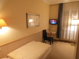 En eller flere senger på et rom på Hotel Turnerwirt