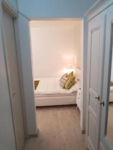 a small bedroom with a bed in a room at cozy apartment in a quiet area in Craiova
