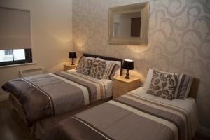 Кровать или кровати в номере Arch House B&B & Apartments