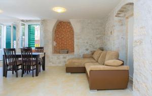 a living room with a couch and a table at M.A.S. in Supetar