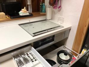 A kitchen or kitchenette at Mannaya -SEVEN Hotels and Resorts-