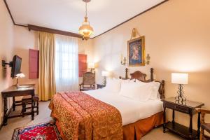 Posteľ alebo postele v izbe v ubytovaní Hotel Dann Monasterio