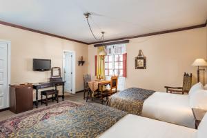Posteľ alebo postele v izbe v ubytovaní Hotel Dann Monasterio