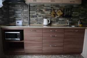 A kitchen or kitchenette at Apartmens on Geroiv ATO