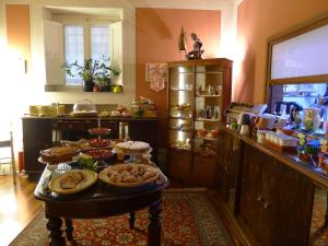 a kitchen with a table with food on it at Albergo San Martino & Depandance in Lucca