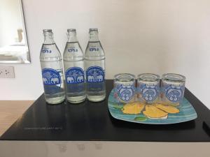 a group of bottles and glasses on a table at BanKhun in Nakhon Ratchasima