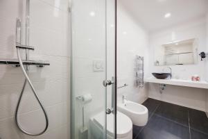 a bathroom with a shower and a toilet and a sink at La casa di Giovanni in Lecce