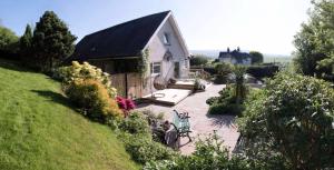 a house with a pathway leading to a yard at Castlecroft Bed and Breakfast in Stirling