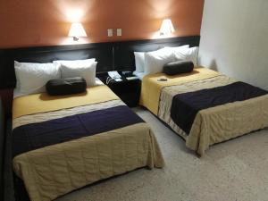 Cama o camas de una habitación en Hotel Valgrande