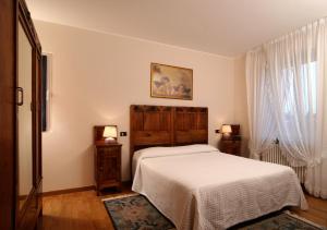 Un pat sau paturi într-o cameră la Hotel Ristorante Fatur