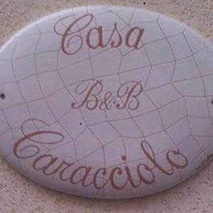 a sign that says casa be margaritas on a rock at Casa Caracciolo B&B in Grottaglie