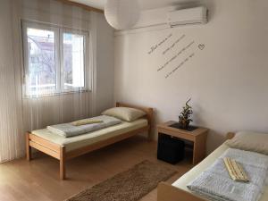 Postel nebo postele na pokoji v ubytování Rooms Deny
