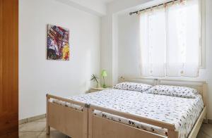 Posteľ alebo postele v izbe v ubytovaní Sabbia1 CaseSicule, Apartment in the City Center and beside the Main Square, Beach at 100 m, Wi-Fi