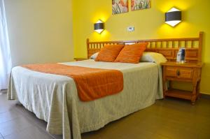 Postel nebo postele na pokoji v ubytování Hotel La Colina