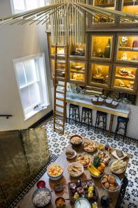a table filled with lots of different types of food at The Ampersand Hotel - Small Luxury Hotels of the World in London