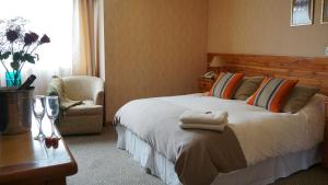 Un ou plusieurs lits dans un hébergement de l'établissement Hotel Borde Lago