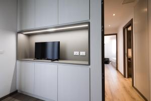 TV a/nebo společenská místnost v ubytování Milan Residence