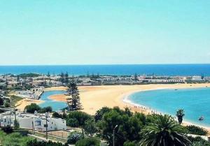 a view of a beach and the ocean at Thalassa in Oualidia