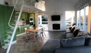 a living room with a couch and a table at Celtigos Beach Resort in Santa Marta de Ortigueira