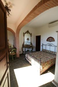 En eller flere senge i et værelse på Agriturismo Villa Isa