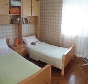 Postel nebo postele na pokoji v ubytování Ana & Marko-Island Ošljak
