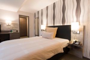 מיטה או מיטות בחדר ב-Hotel Westermann