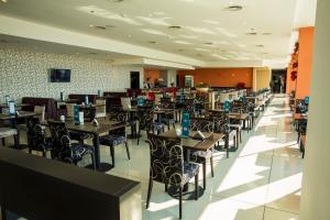 Un restaurant u otro lugar para comer en Gala Hotel y Convenciones