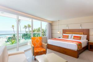 Postel nebo postele na pokoji v ubytování Hotel Dann Cartagena