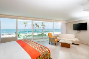 Postel nebo postele na pokoji v ubytování Hotel Dann Cartagena