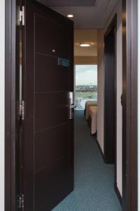 Una cama o camas en una habitación de Gala Hotel y Convenciones